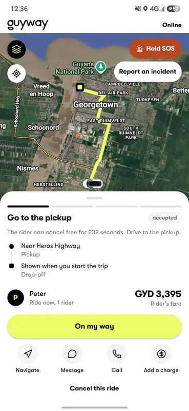 App GuyWay Driver camino a la recogida: la ruta en un mapa satelital de Georgetown, los botones SOS y Reportar un incidente, el punto de recogida, el nombre del pasajero y el botón En camino