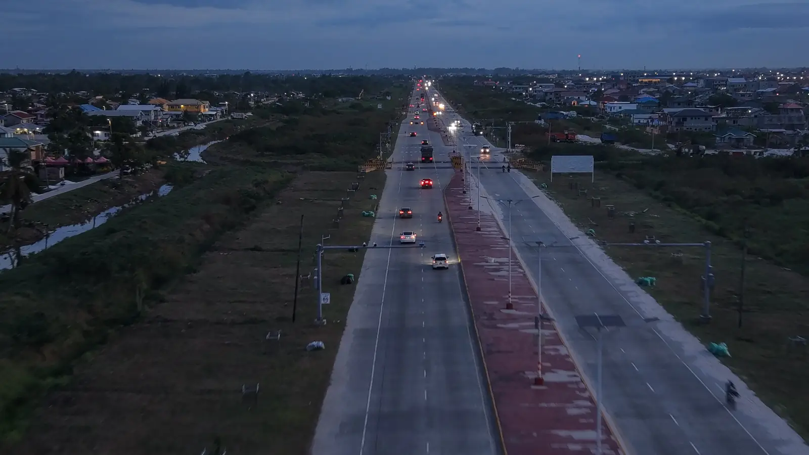 The East Bank Highway at dusk, seen from above looking along the road